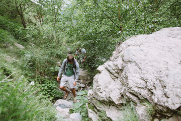 two young men hiking in the mountains