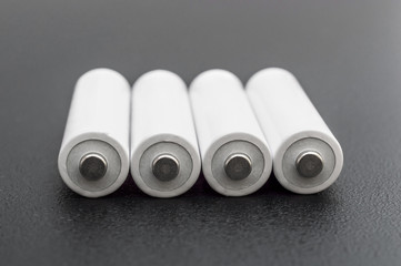 Batteries on black background. Close up.