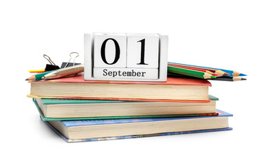 Date of 1st september with school supplies on white.