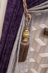 fragment of luxurious curtains with fringe and tassel