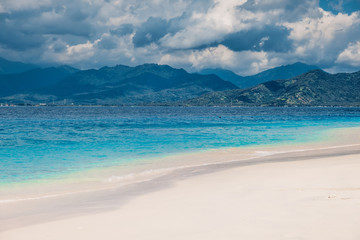 Tropical beach and blue ocean in paradise island