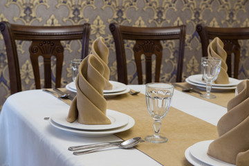 serving banquet table in a luxurious restaurant in beige and white style