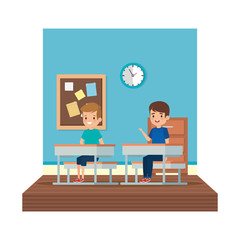 little students boys seated in school desk on the classroom