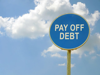 Road sign pay off debt and blue sky.