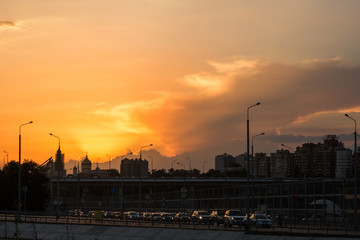 sunset in the city, orange clouds, industrial time