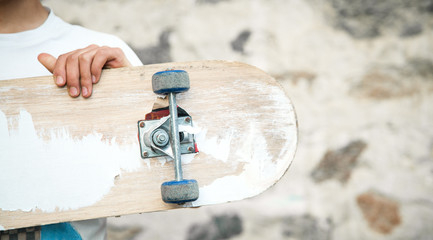 Caucasian boy with skateboard in his hand. © andranik123