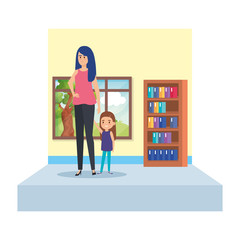 female teacher and little girl in school classroom