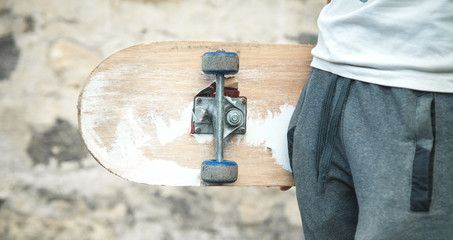 Caucasian boy with skateboard in his hand. © andranik123