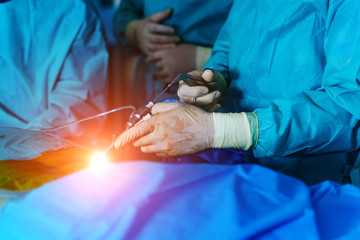 Spinal surgery. Group of surgeons in operating room with surgery equipment. Laminectomy. Modern medical background