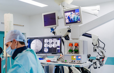 Modern equipment in operating room. Spine Surgery. Group of surgeons in operating room.