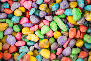 Fototapeta na wymiar Colorful small stones background top view.Contrast style.Colorful pebbles close up.