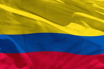 Waving Colombia flag for using as texture or background, the flag is fluttering on the wind