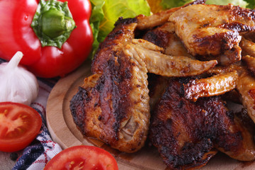 Chicken wings barbecue with different vegetables