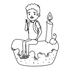 happy little boy seated in cake with candle