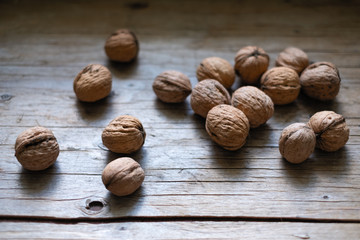 nuts on a wooden table, whole and chipped