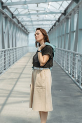 Fototapeta premium Beautiful woman posing on camera with denim jacket in her hands.