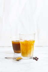 Iced coffee with cream and vanilla in various glasses on white background. Summer cocktail or dessert