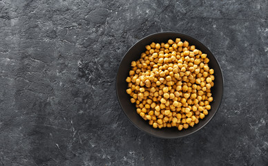 Cooking chickpeas bowl dark stone background top view