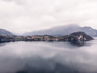 Fototapeta premium Cloudy Lake Como, Italy. Aerial top view