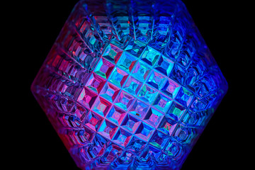 Multicolored rays of light shine through crystals with hexagonal faces