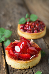 Cakes with fresh berries and mint leaves