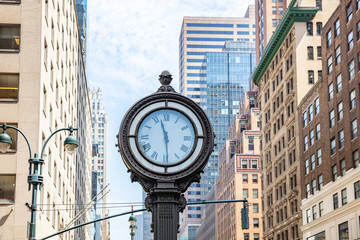 New York, Manhattan 5th ave. Skyscrapers and big clock