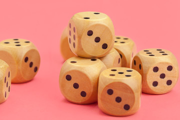 Gaming dice on pink background. Concept for games.
