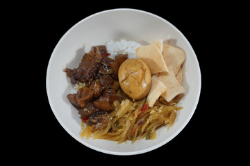 Indonesian food.Rice with side dishes of kikil, eggs and crackers.Delicious food