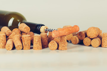 Opening wine bottle with a corkscrew close up