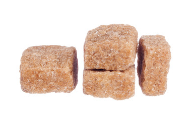 Brown cane sugar cubes isolated on white background