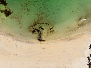Aerial view. Sea water and sandy shoreline