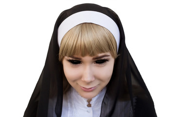 Close-up portrait of a female Catholic nun with black eyes. Obsession with a demon, supernatural. White isolated background.