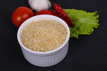 Raw uncooked rice in the bowl