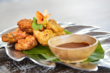 Vegetable fritters with tomato sauce