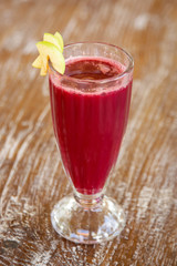 Fresh organic beetroot smoothie in the glass