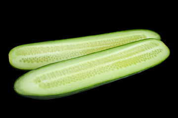 Long green cucumber on black