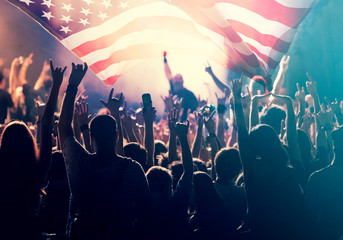 Fototapeta na wymiar United States flag - crowd celebrating 4th of July Independence Day.