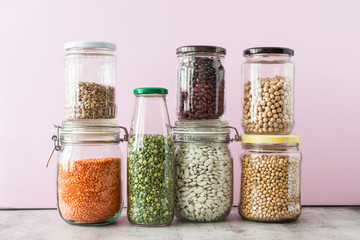 Variety of grains in glass jars. Zero waste storage concept
