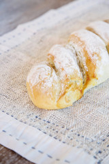 Homemade fresh baked bread on the wooden table