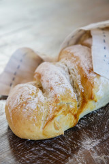 Homemade fresh baked bread on the wooden table