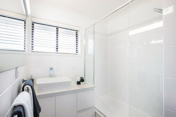 Bathroom with Towel Hangers and Tub