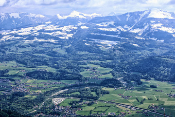 Fototapeta na wymiar Salzburg alpine valley from the top with cloudy sky