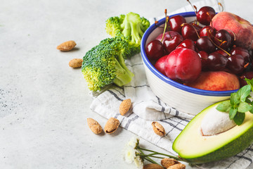 Summer fruits, nuts and berries background. Healthy food concert.