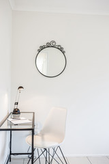 Study Area with a Lamp Shade, Chair and Mirror