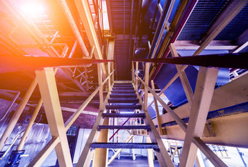 Interior of modern natural oil factory. The piping, pumps and motors