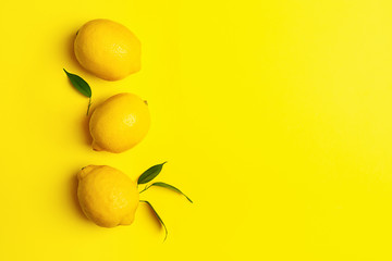 Fresh juicy lemon on a bright yellow background. Concept minimalism. Horizontal frame. Copy space.