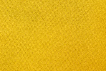 Yellow fabric texture background, seamless pattern of natural textile surface.