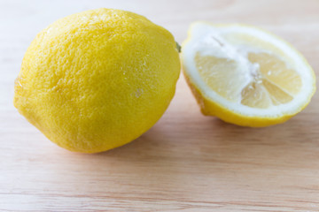 Fresh lemons on wooden background.  Top view with copy space