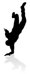 A male street dance hip hop dancer in silhouette