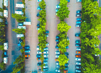 Aerial view of a large parking lot with vehicles